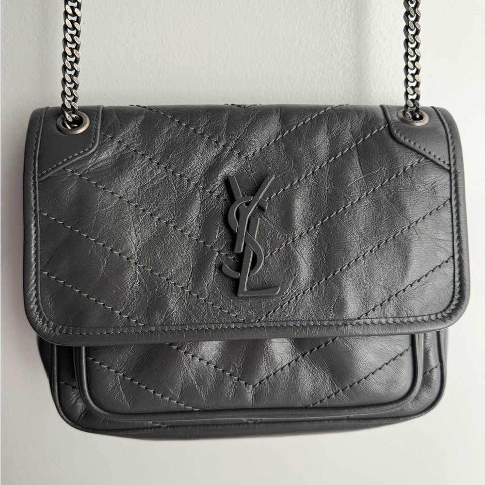 Brand new, never worn Niki Baby quilted YSL bag.